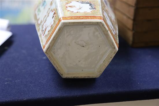 A Chinese famille rose mandarin hexagonal baluster vase, Qianlong period, H. 37.4cm, slight restoration to rim
